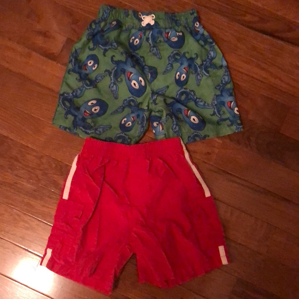 2 pairs of swim shorts. Size 18M